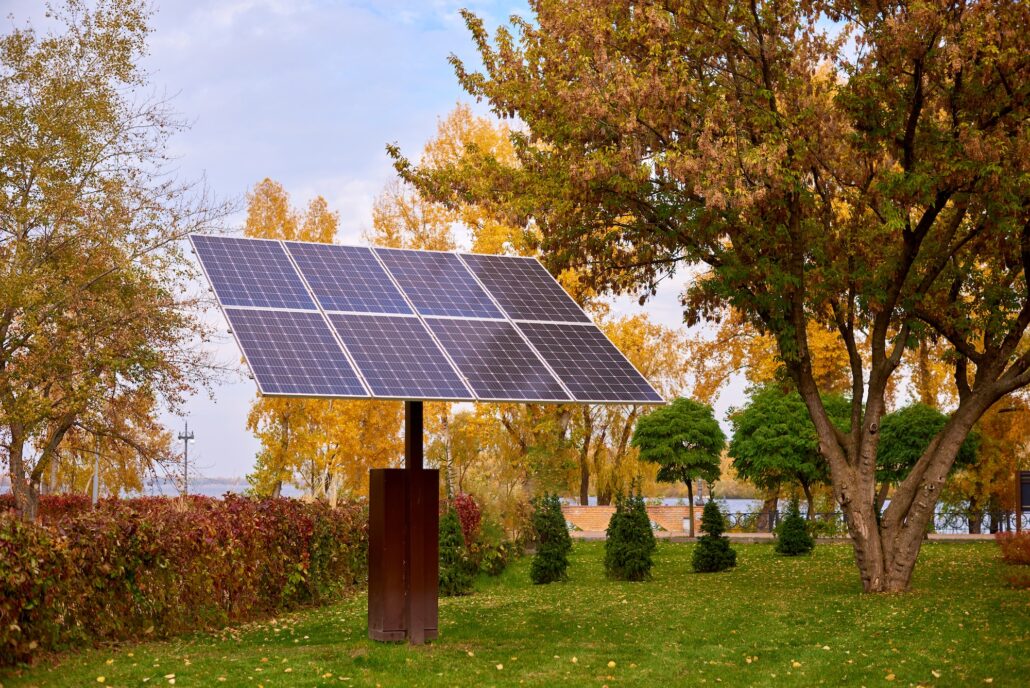 Environmental protection solar panels in city park on sunny fall day