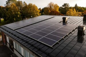 roof solar cells, autumn forest background