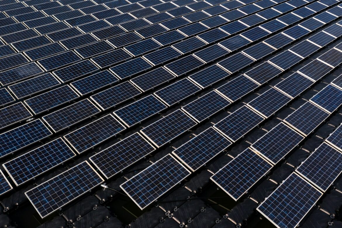 Aerial view solar cell panels farm power plant on water, Solar cell panels farm power plant.