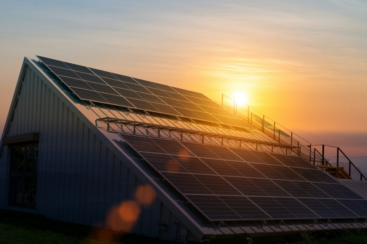 Photovoltaic, Solar Cell panels on a Roof with sunset sky background. Technology solar energy